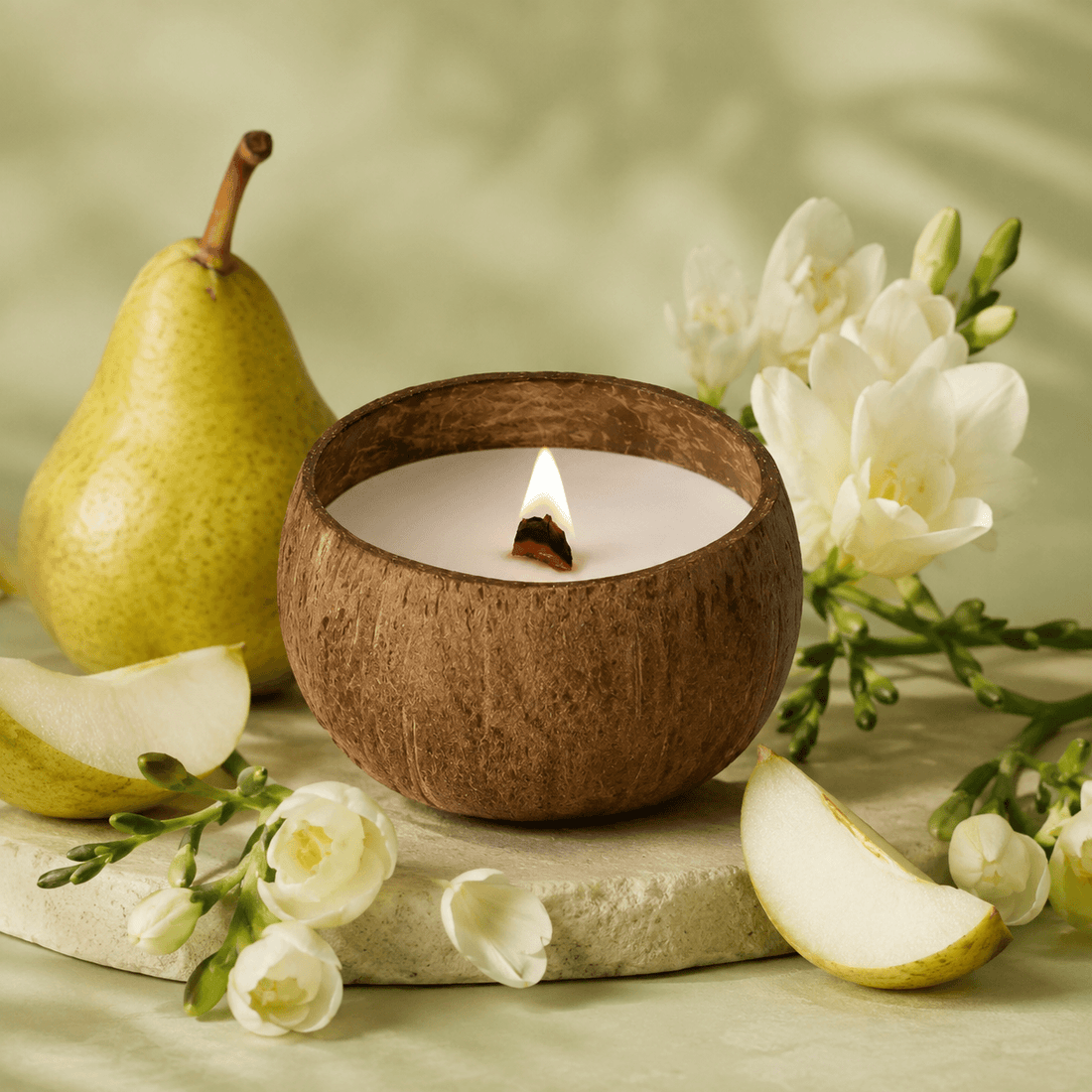 Coco Haven Coconut Shell Candle — English Pear & Freesia fragrance profile